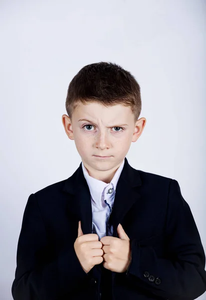 Funny emotion of  little boy young man with a raised eyebrow wearing costume