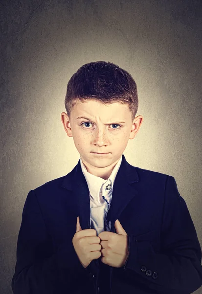 Funny emotion of  little boy young man with a raised eyebrow wearing costume