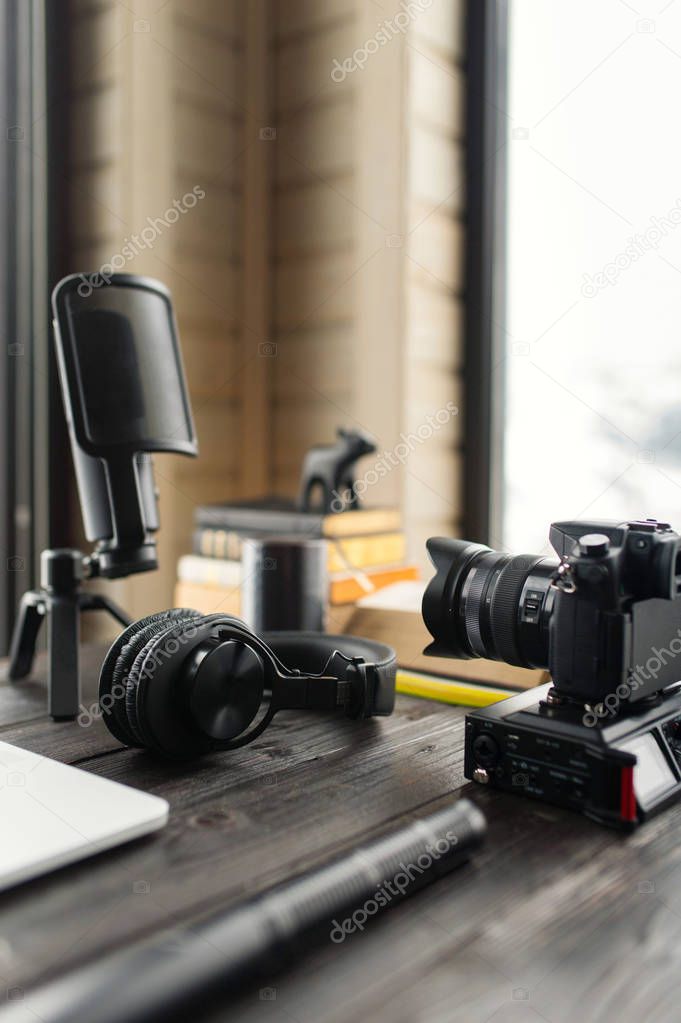 Audio / Video editing workspace office with mountain view. Photography and videography equipment.