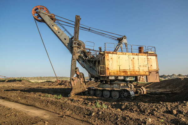 Biggest excavator in the world working, Bagger 228, Ukraine. Big mine, develop mineral resources, excavator digs, metallurgy in Ukraine