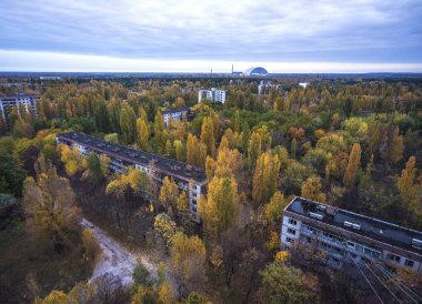 Abandoned Pripyat city in Chernobyl Exclusion Zone at autumn time clipart