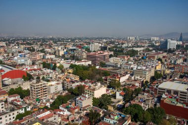 Aerial view of a neighborhood called Colonia Juarez in Mexico City, Mexico, on a sunny morning with some haze. clipart