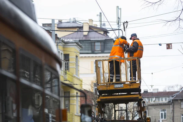 Tram cables workers repairing — Stock Photo, Image