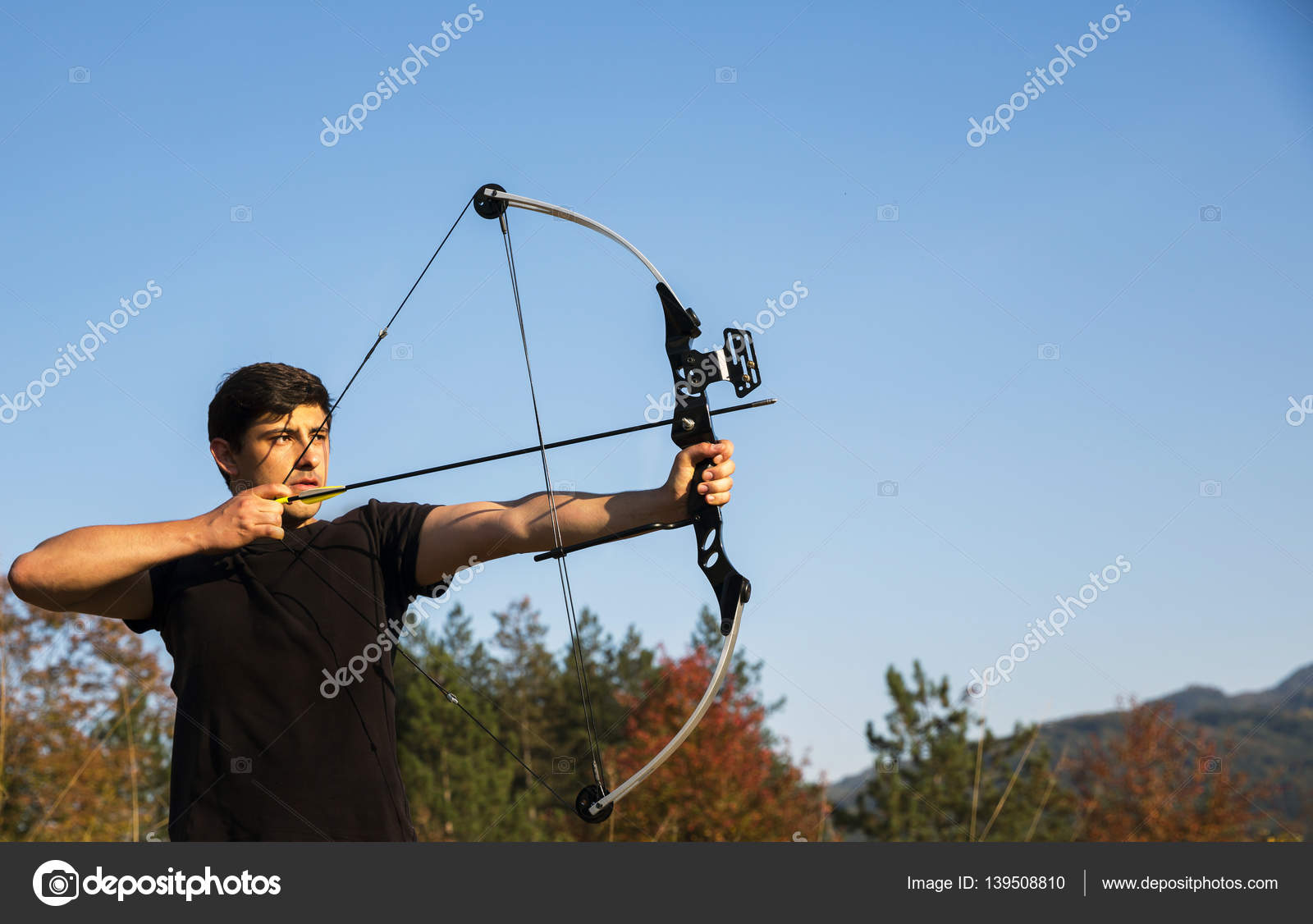 Archer draws his compound bow Stock Photo by ©Belish 139508810