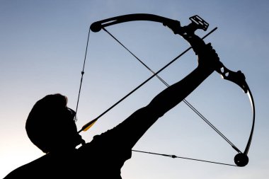 Archer draws his compound bow silhouette clipart