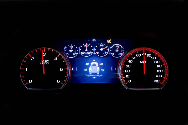 Modern light car mileage on black background TSI — Stock Photo, Image