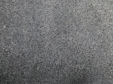 Duvarın dışındaki grunge dokusu. Kaba asfaltın ayrıntılı deseni