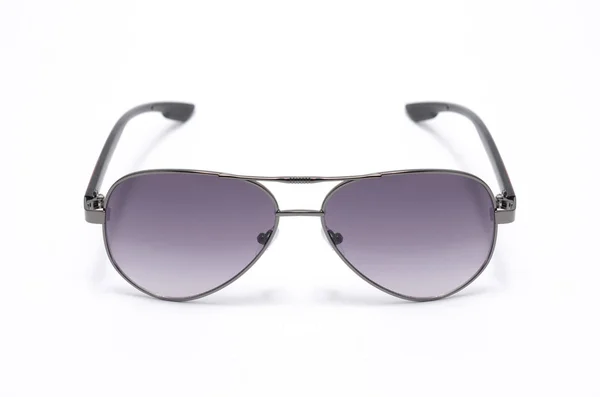 Solglasögon med lila glas i en järn ram isolerad på vit — Stockfoto
