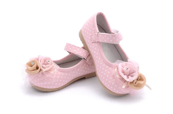 Baby pink shoes isolated on white — стоковое фото