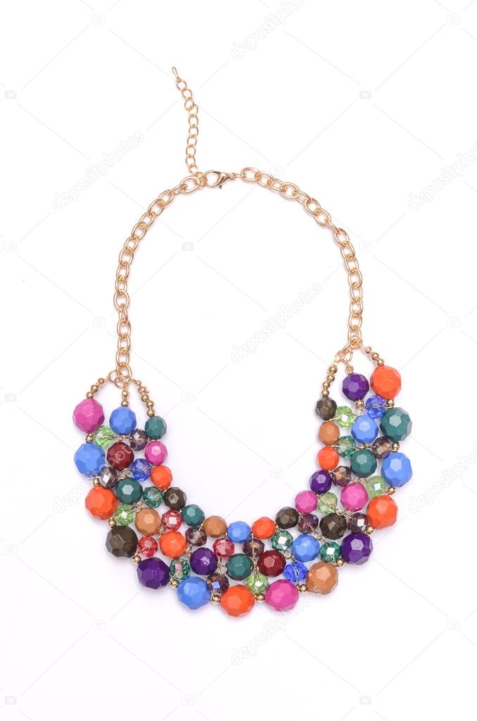 gold necklace with color beads isolated on white