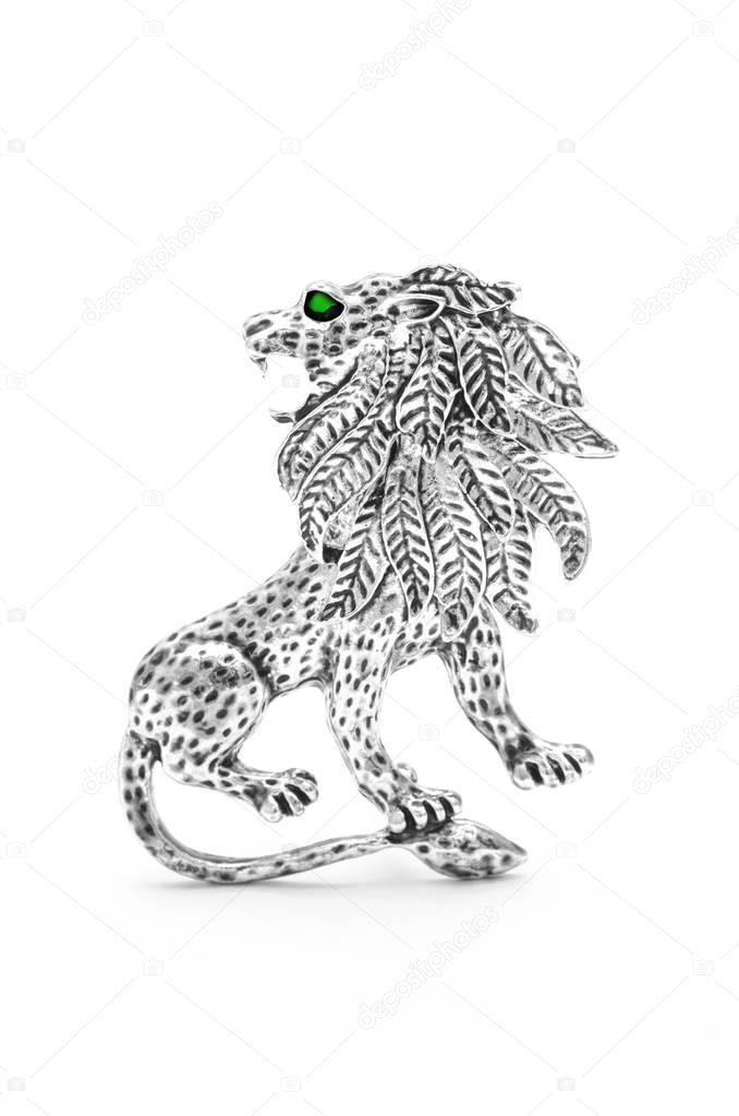 Silver lion brooch isolated on white