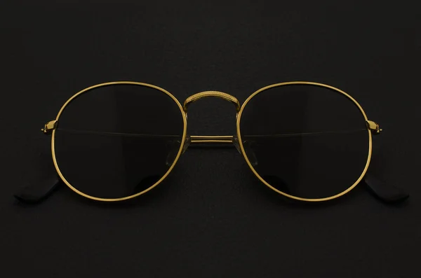 Round sunglasses isolated on black without glare — Stock Photo, Image