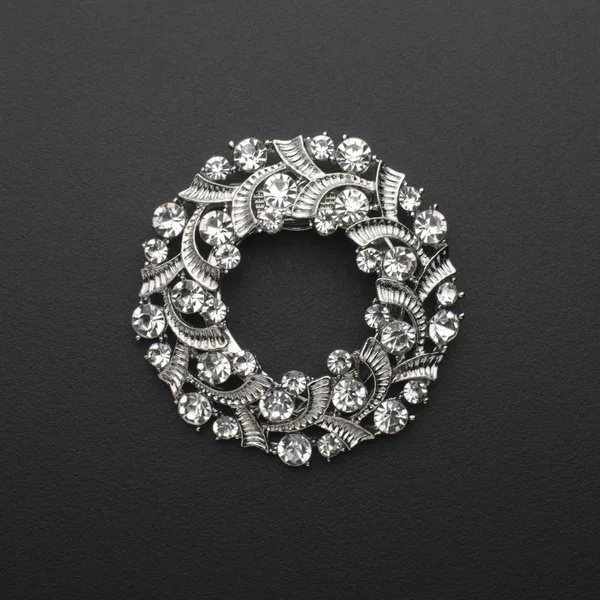 Round brooch with diamonds isolated on black — Stock Photo, Image