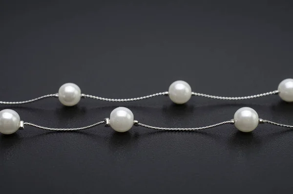 Silver necklace chain with pearls isolated on black — Stock Photo, Image