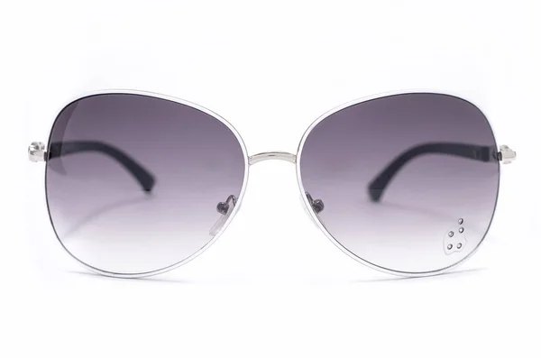 Beyaz izole bir demir çerçeve içinde Bayan güneş gözlüğü — Stok fotoğraf