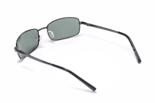 Prostokątne okulary w cienkiej metalowej ramie na białym tle — Zdjęcie stockowe