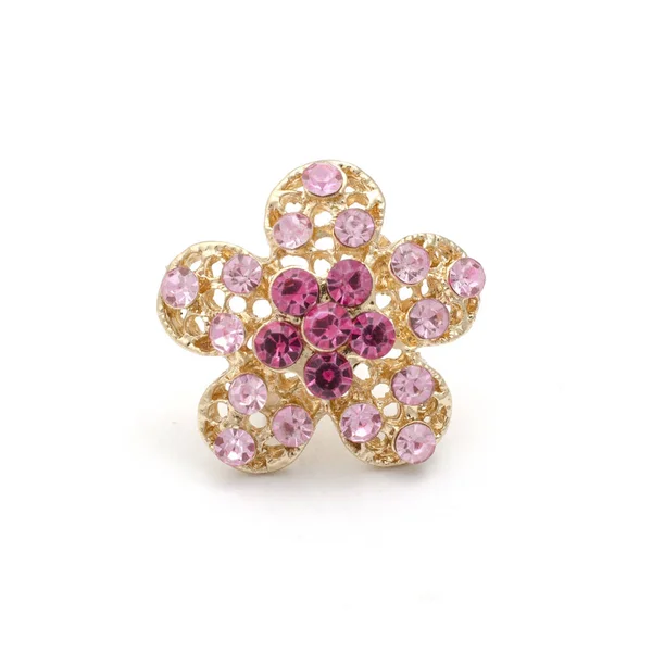 Gold brooch flower with pink diamonds isolated on white — Stock Photo, Image