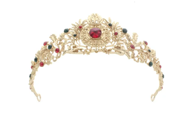 Coroa dourada com rubis em um fundo branco — Fotografia de Stock