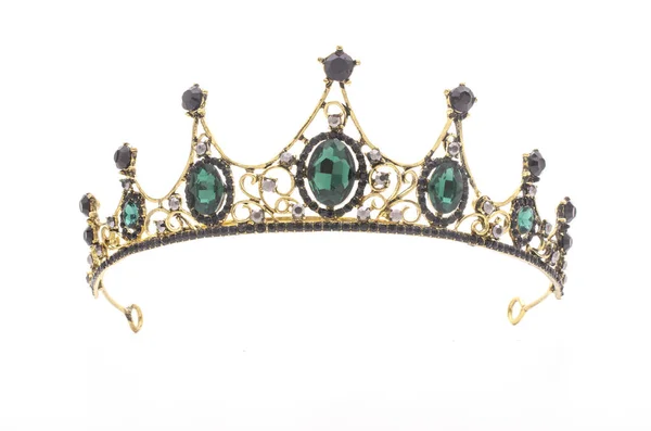 Золотая корона с изумрудами на белом фоне Лицензионные Стоковые Фото