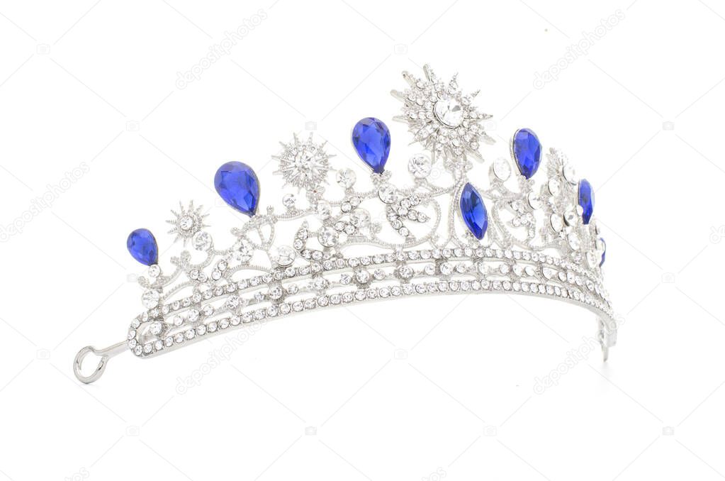 silver tiara with diamonds and sapphires on black