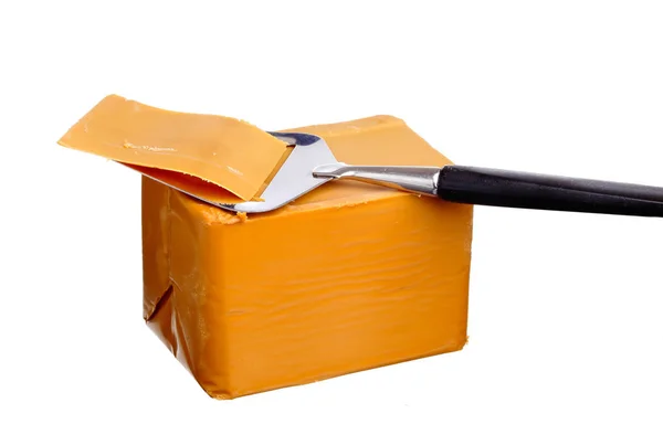 Whey cheese with slicer. — Stock Photo, Image