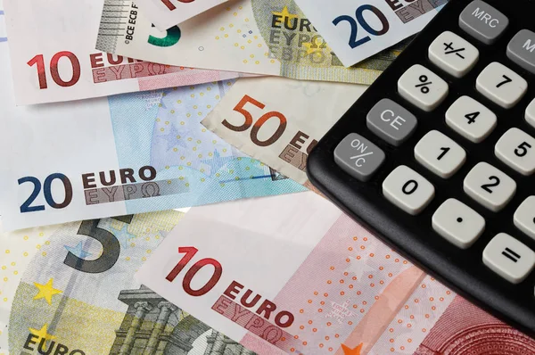 Calculator on a euro bills — Stock Photo, Image