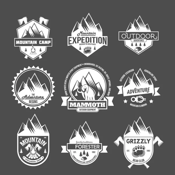 Mountain adventure and travel emblems — Stock Vector