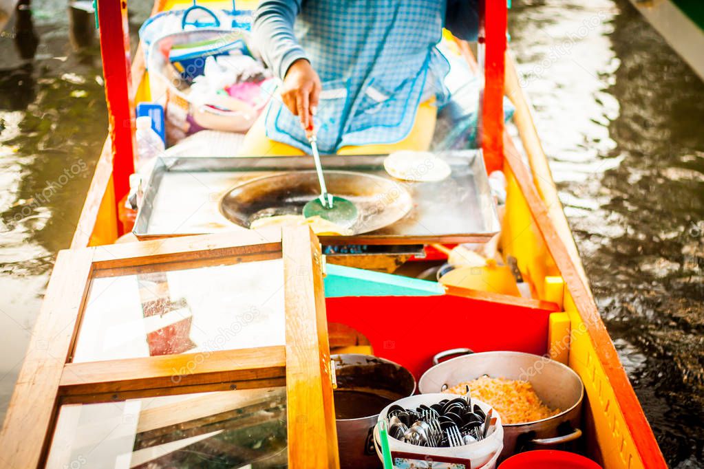 Mexican vendor of food on Xochimilco gondola trajinera