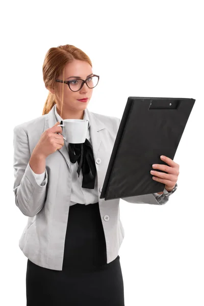 Business woman holding a cup and a clipboard — Stock Photo, Image