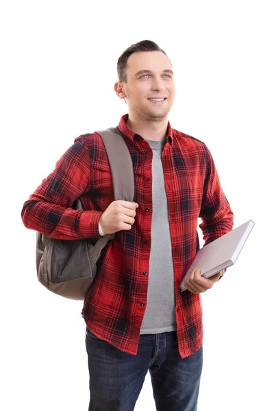 Sırt çantası ve not defteriyle sıradan giyinmiş gülümseyen erkek öğrenci — Stok fotoğraf