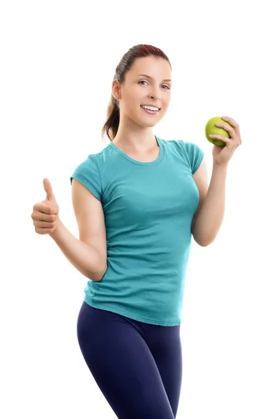 Mujer joven sosteniendo manzana verde y dando el pulgar hacia arriba — Foto de Stock