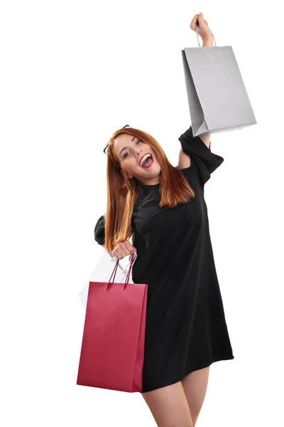 Alışveriş torbalarıyla heyecanlı ve mutlu genç bir kadın. — Stok fotoğraf