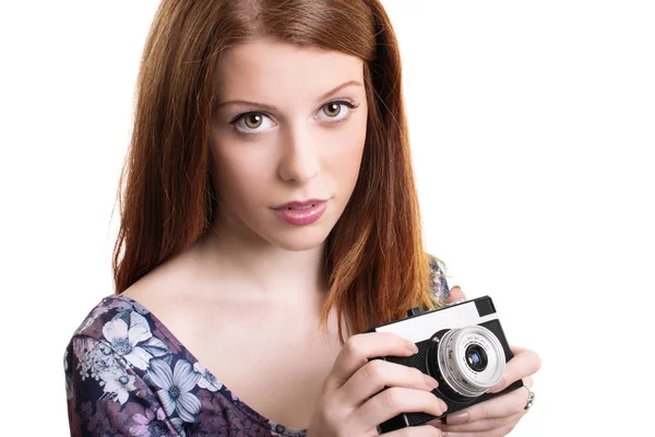 Young girl holding a retro film camera — Stock Photo, Image