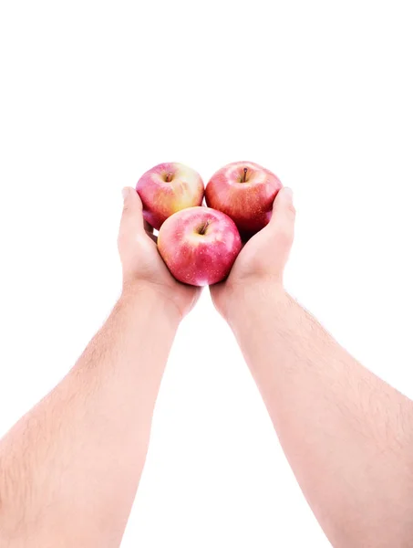 Wyciągnięte dłonie oferujące czerwone jabłka — Zdjęcie stockowe