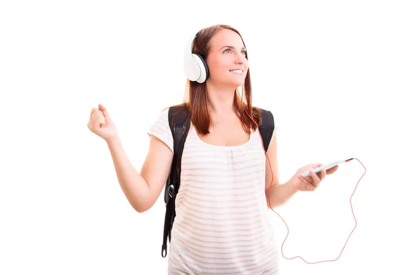 美しい笑顔のブロンドの若い女の子のヘッドフォンの音楽に耳を傾け 白い背景に隔離された 音楽と音のコンセプト — ストック写真