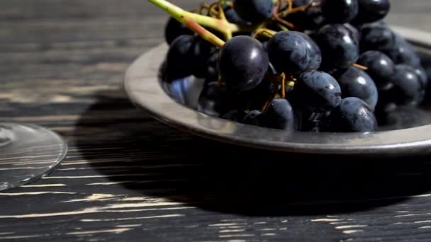 Close up bunch of Grapes , glass of red wine and bottle. — Stock Video