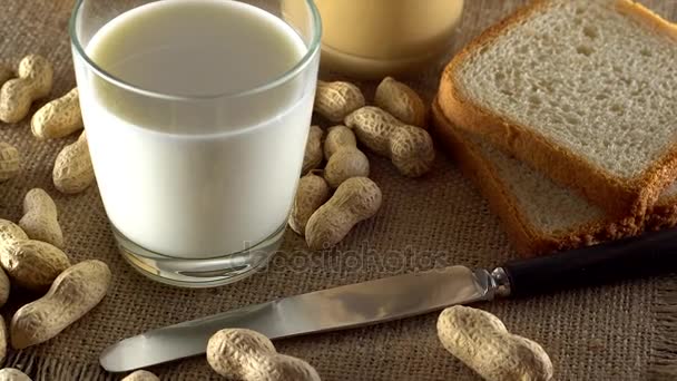 Tasty peanut butter, milk and white toasts — Stock Video