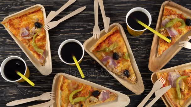 Slices of pizza on wooden plates. Party concept. — Stock Video