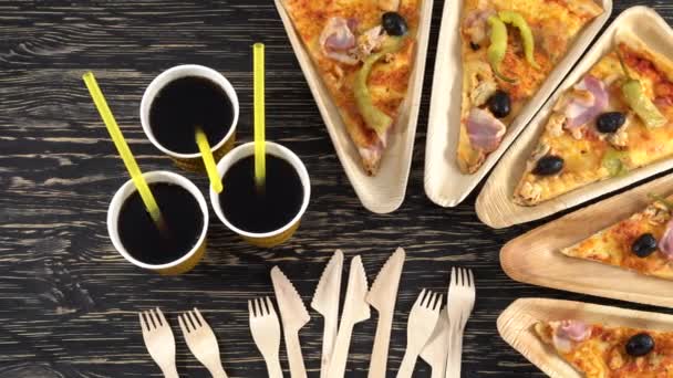 Slices of pizza on wooden plates. Party concept. — Stock Video