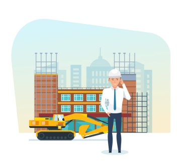 Proje Yöneticisi, yapım aşamasında çerçevede teknik belgeler ile.