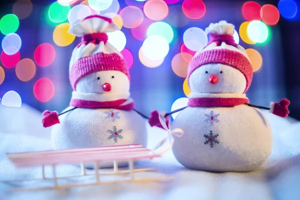 Two snowmen with a sled — Stock Photo, Image