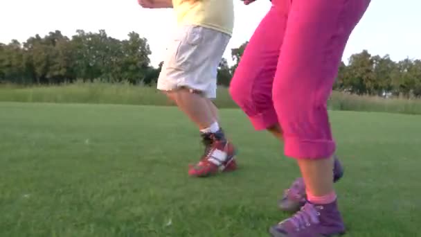 Legs of jogging couple. — Stockvideo