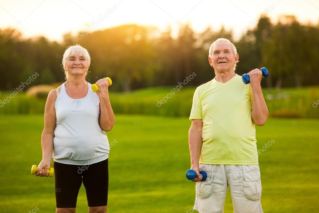 Old couple with dumbbells.