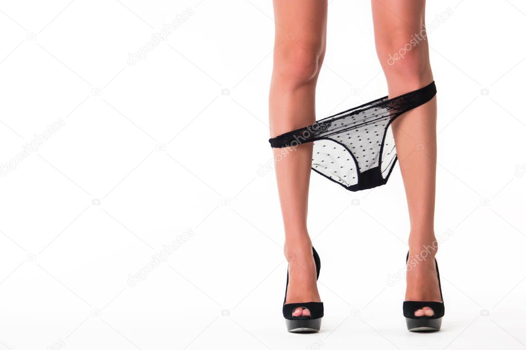 Female legs with panties down.