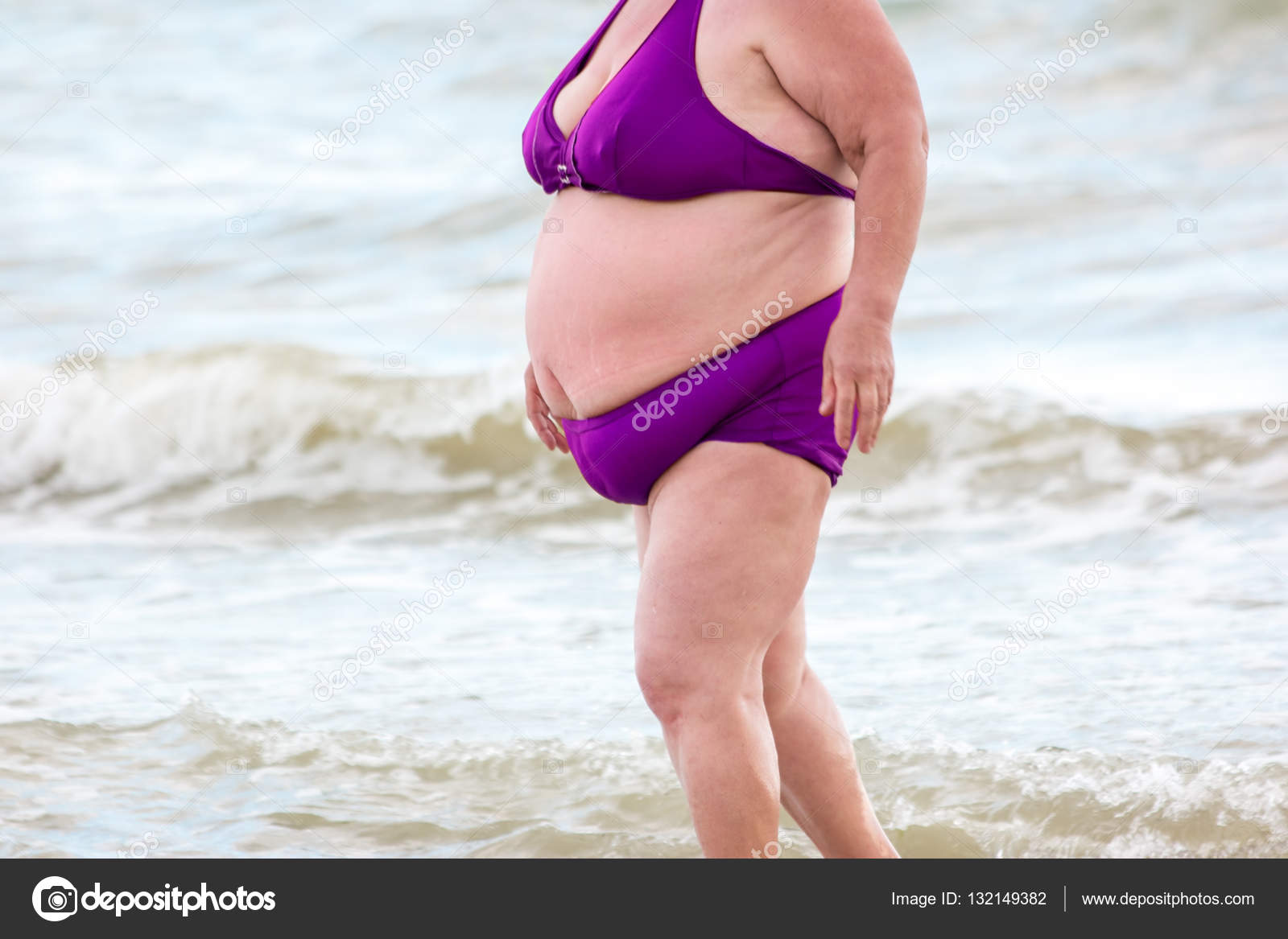 Fat lady on the beach. 