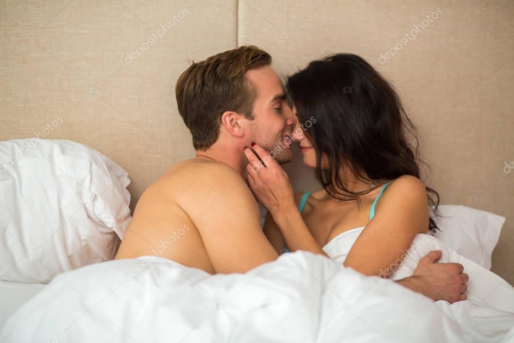 Woman with man in bed.