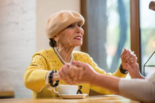 Senior women holding hands. — Stock Photo, Image