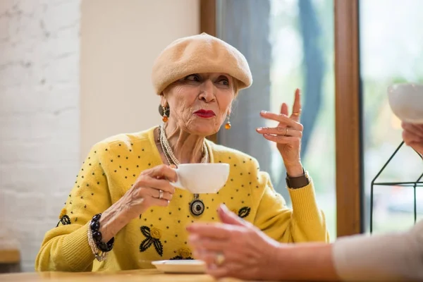 Senior lady with cup. — Stock Photo, Image