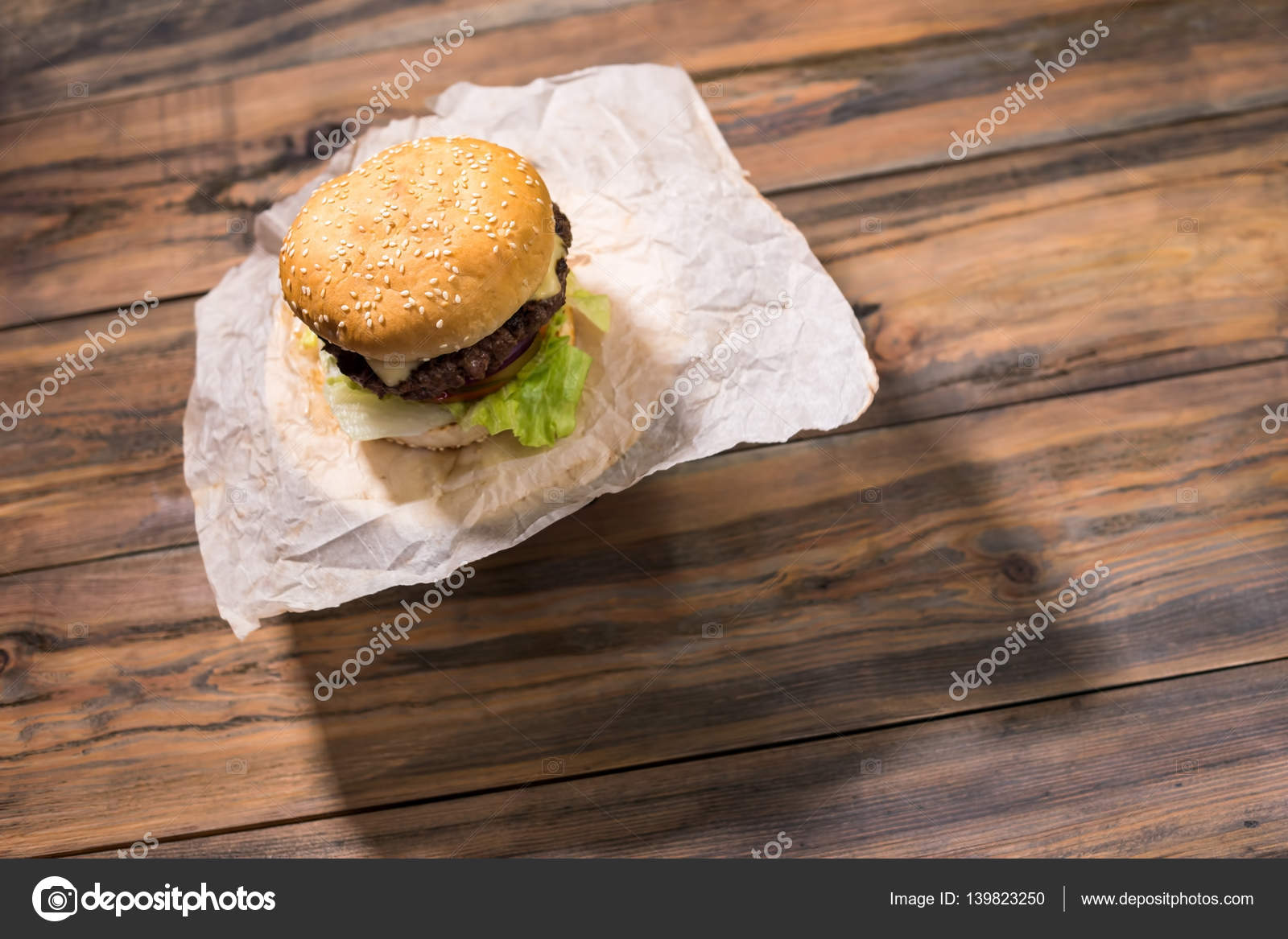 Burger on wooden background. — Stock Photo © Denisfilm #139823250