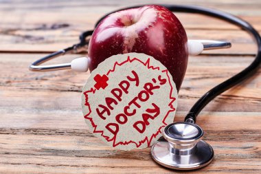 Apple, doktorlar günü kartı, stetoskop.